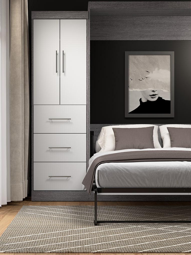 Modern bedroom with gray bedding, white wardrobe, and black and white abstract art on the wall.