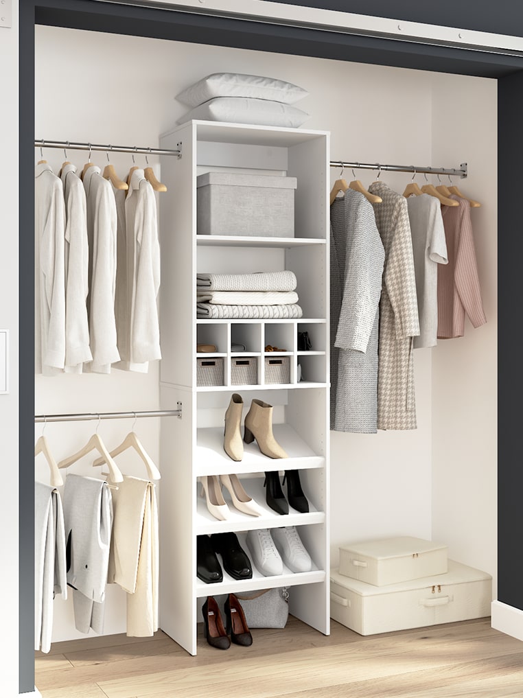 Carina Collection closet with clothes hanging on racks and shelves with shoes and boxes.