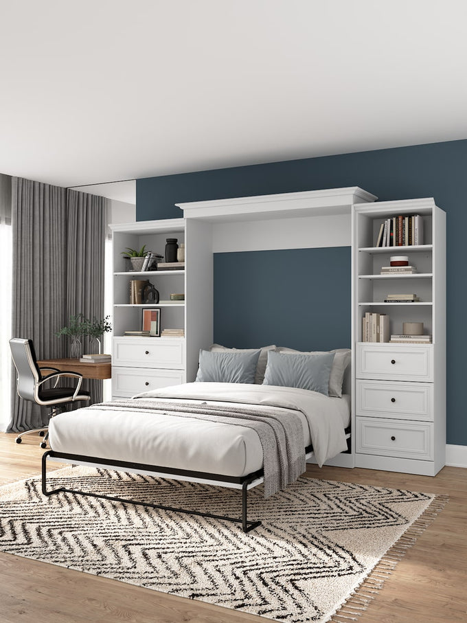 White Versatile collection Murphy bed with bookshelves in a bedroom setting with a desk and chair.
