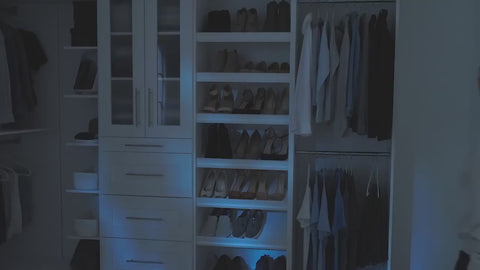 Florence collection closet system in use by a woman