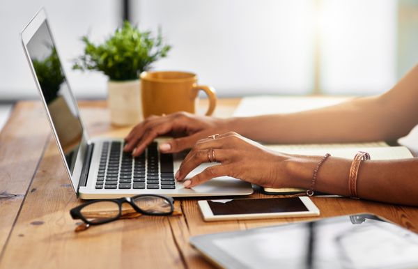 woman typing on laptop