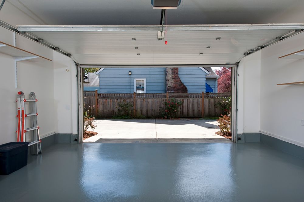 Open garage door with cement floor