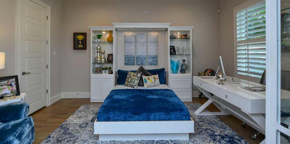 wall bed with blue comforter