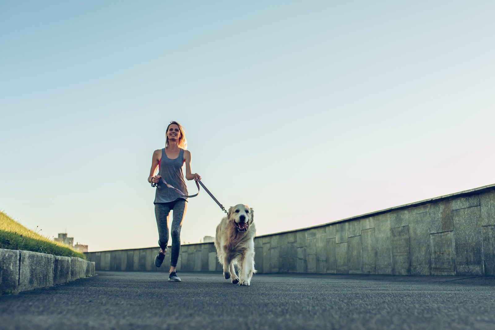 Woman jogging with her dog
