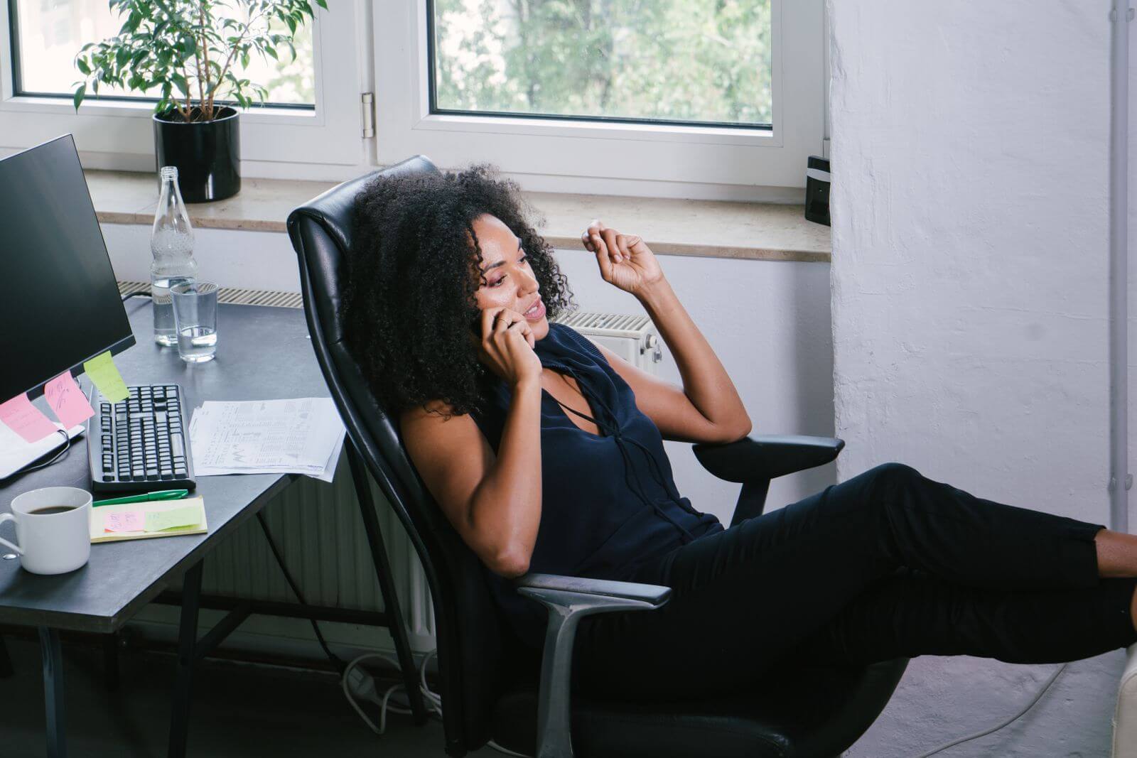 Woman sitting in home office chair