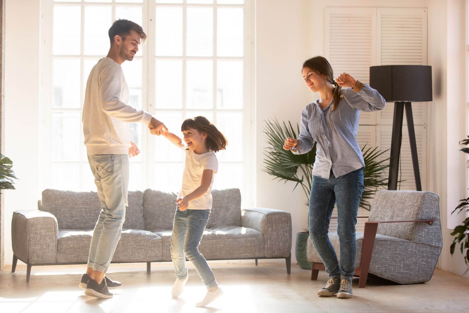 Family dancing in living room