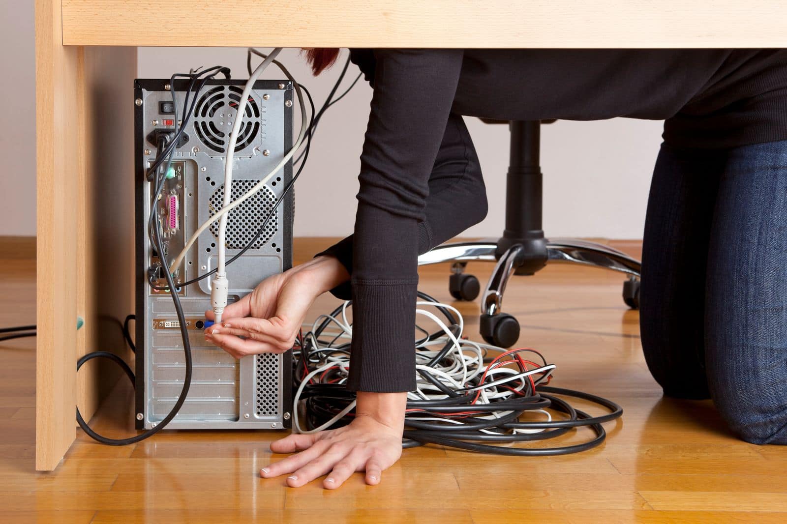 Woman playing with knotted wires and cables