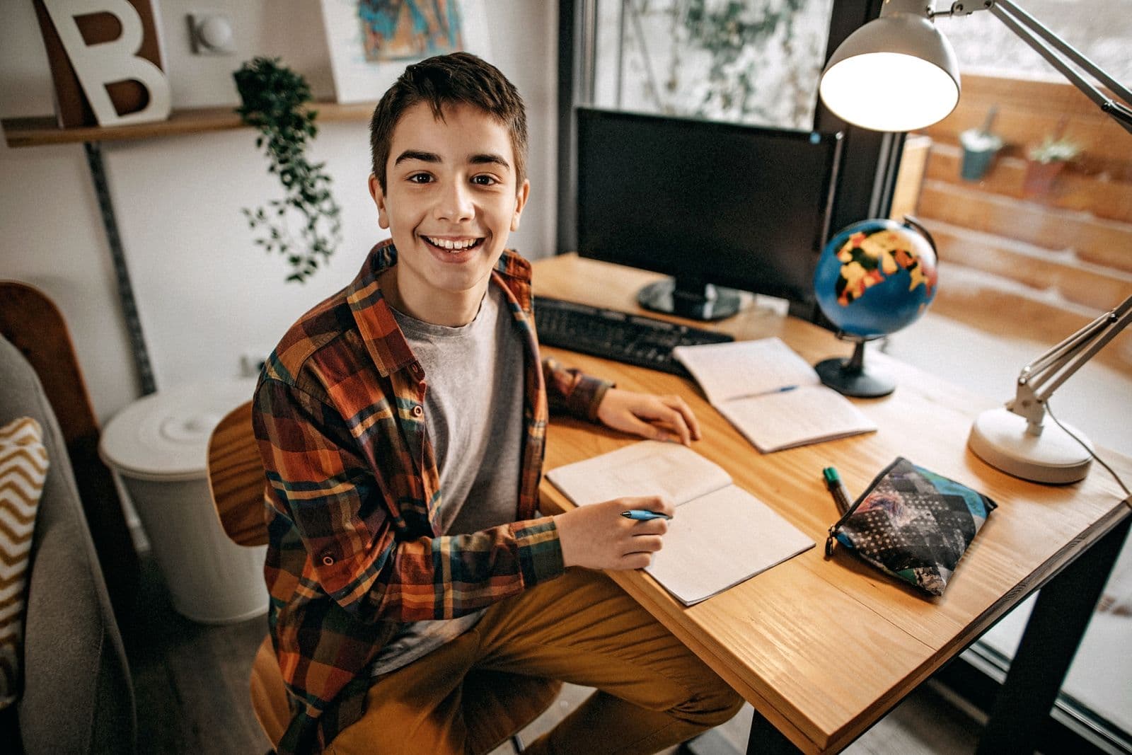 Teenage boy studying at home