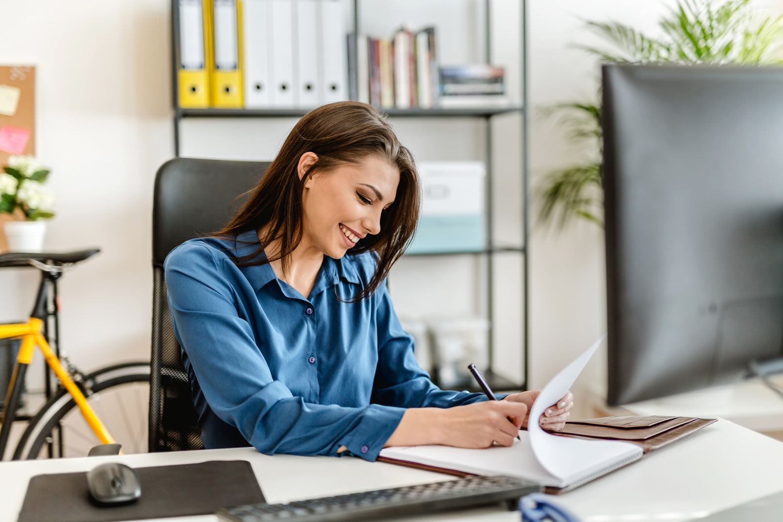 Happy woman working at her desk