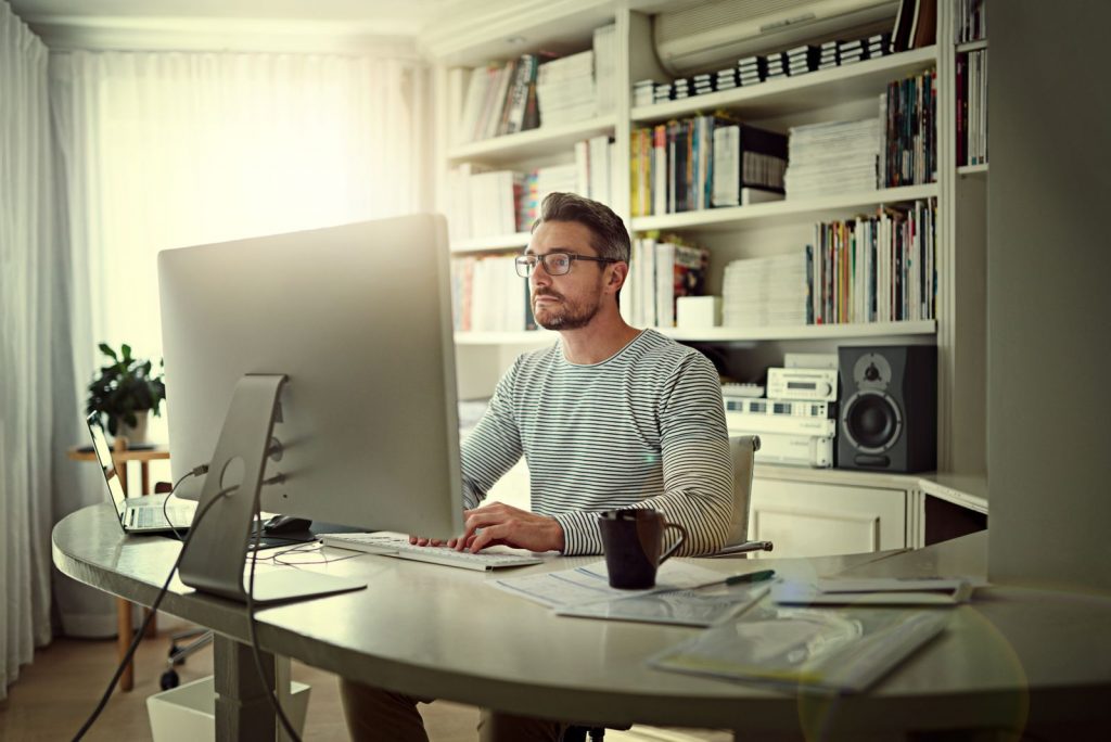 Man teleworking in his home office