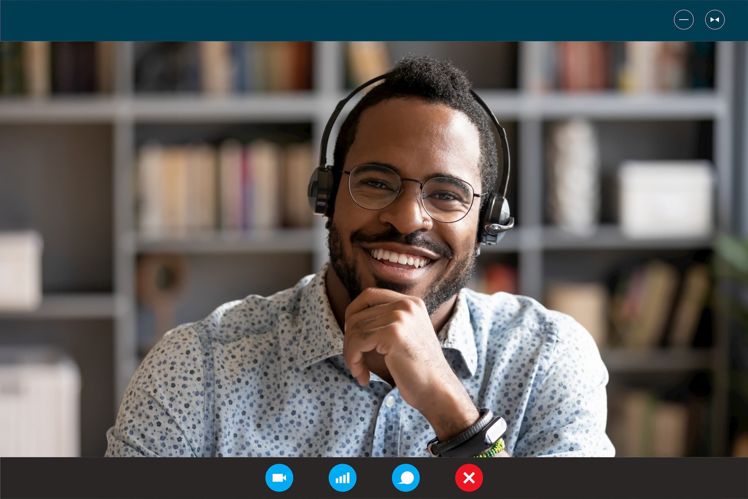 Happy man wearing headphones for a video conference