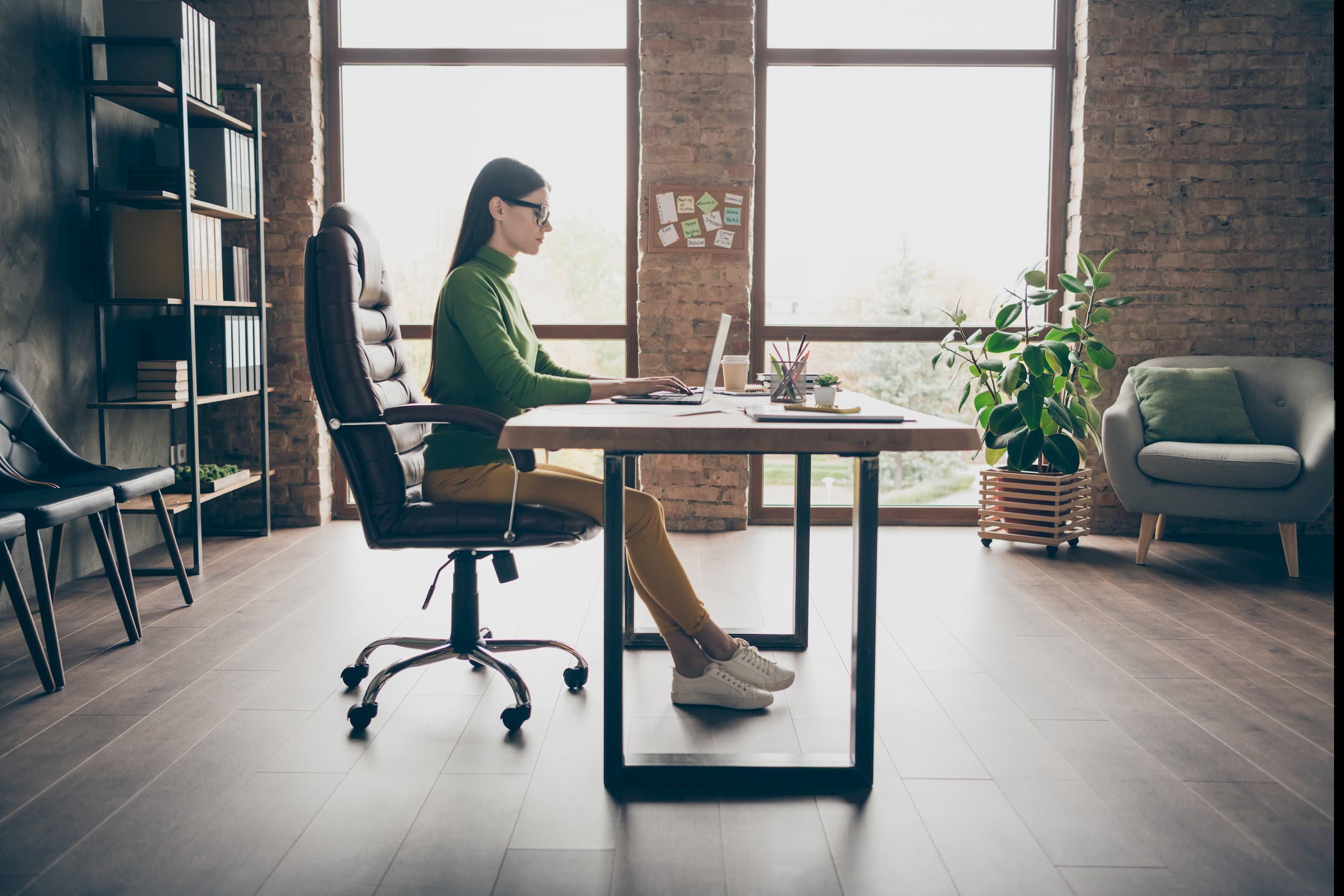 Woman working from home in an ergonomic office chair