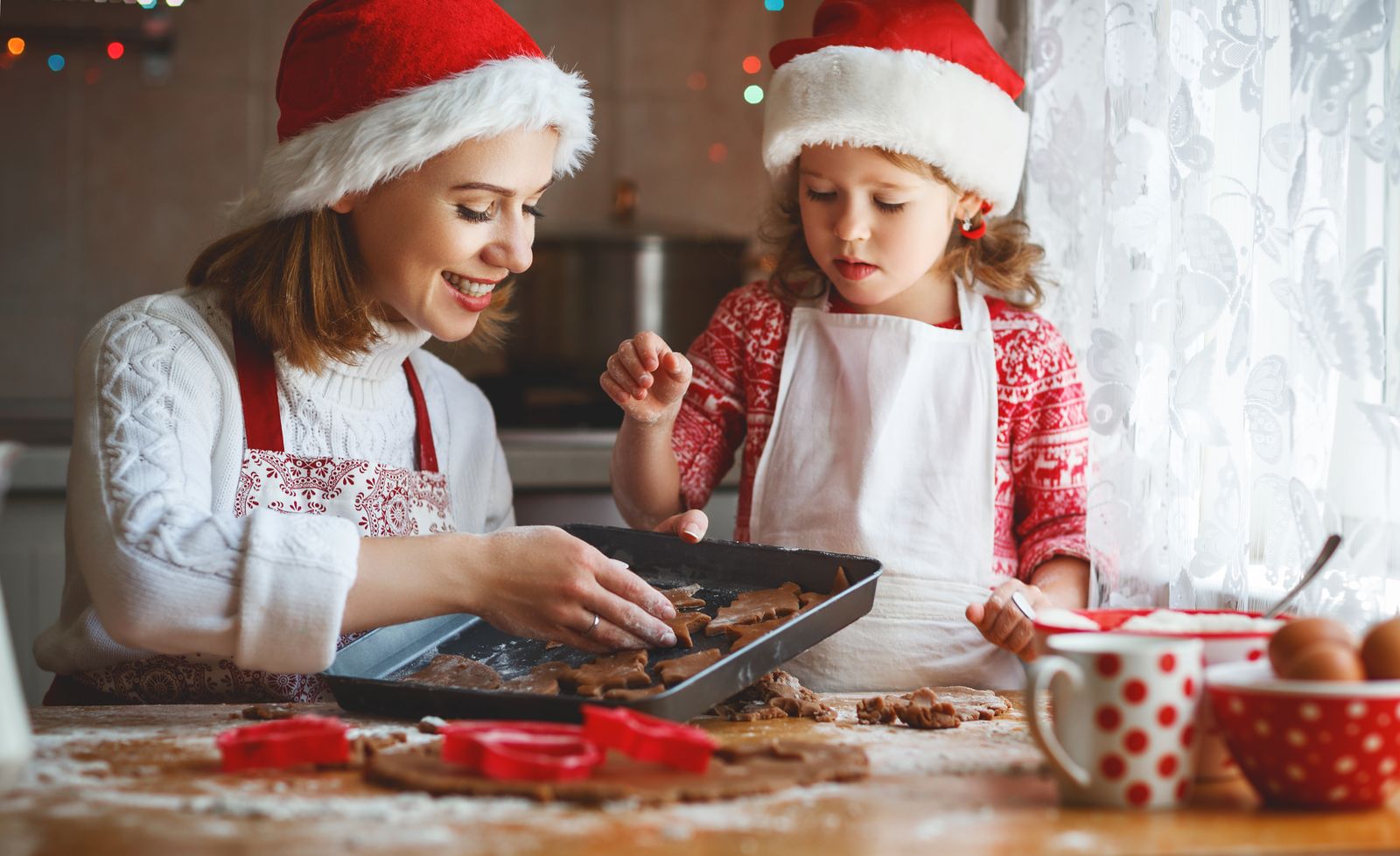 Mother and daughter baking cookies