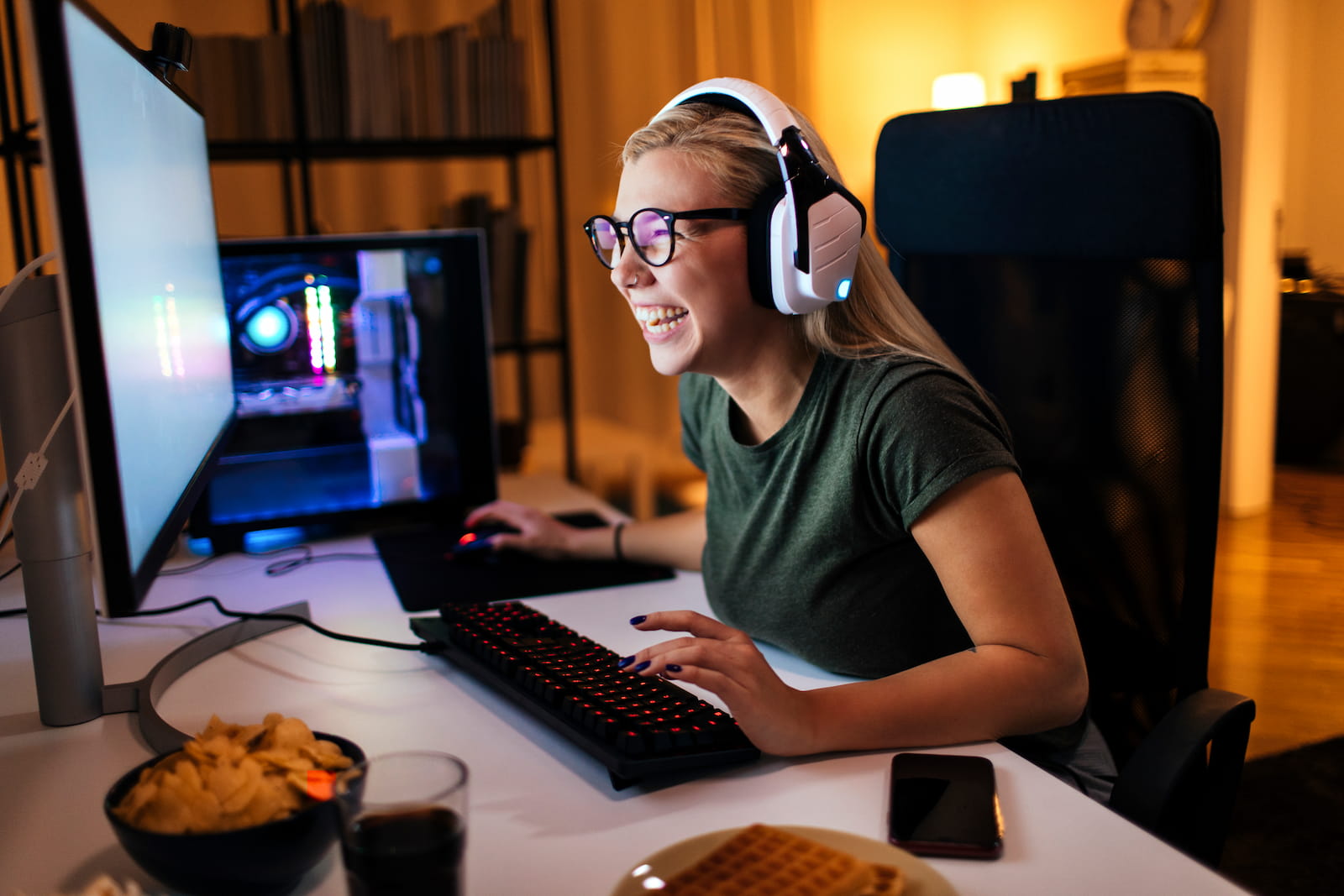 girl laughing whilte playing videogames