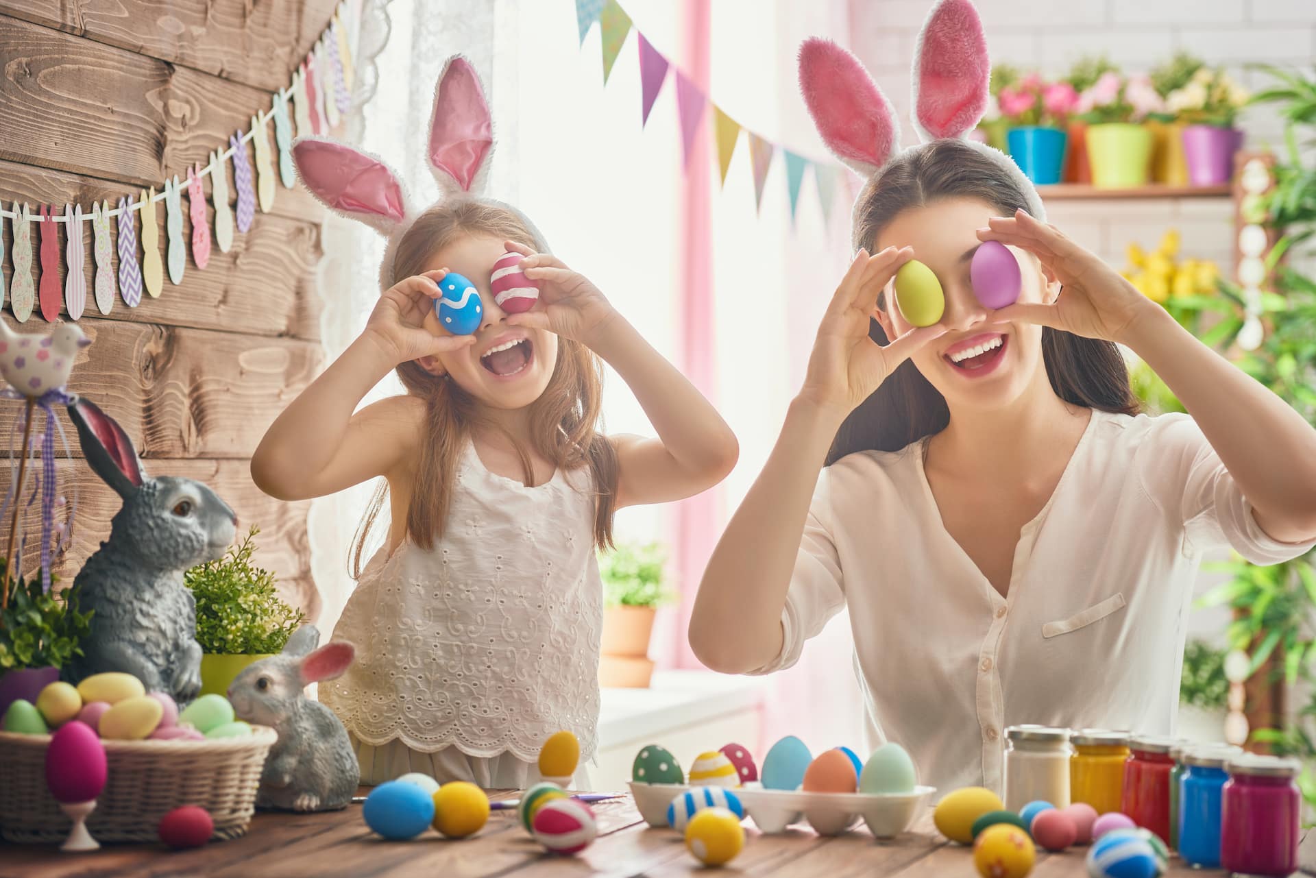 mother and daughter playing easter eggs