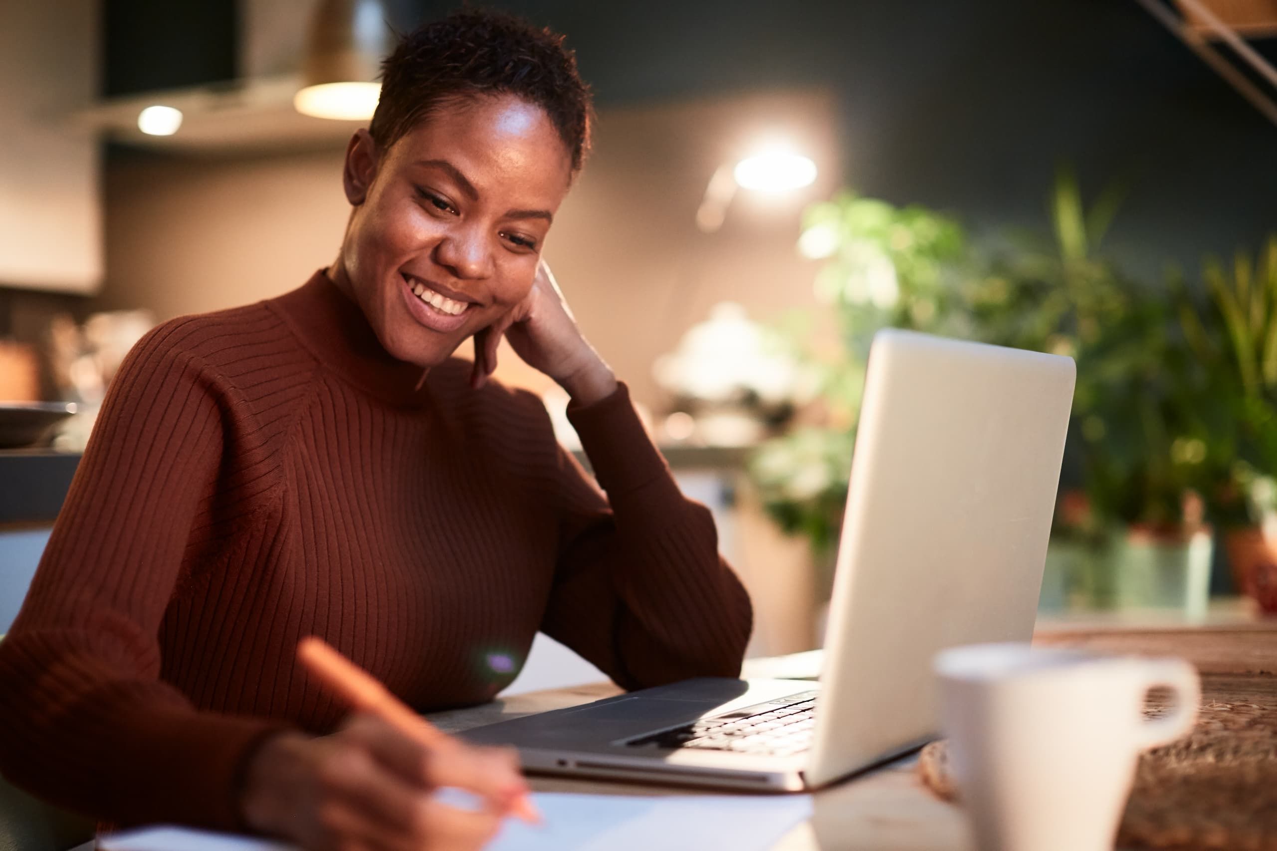 woman writing with her computer