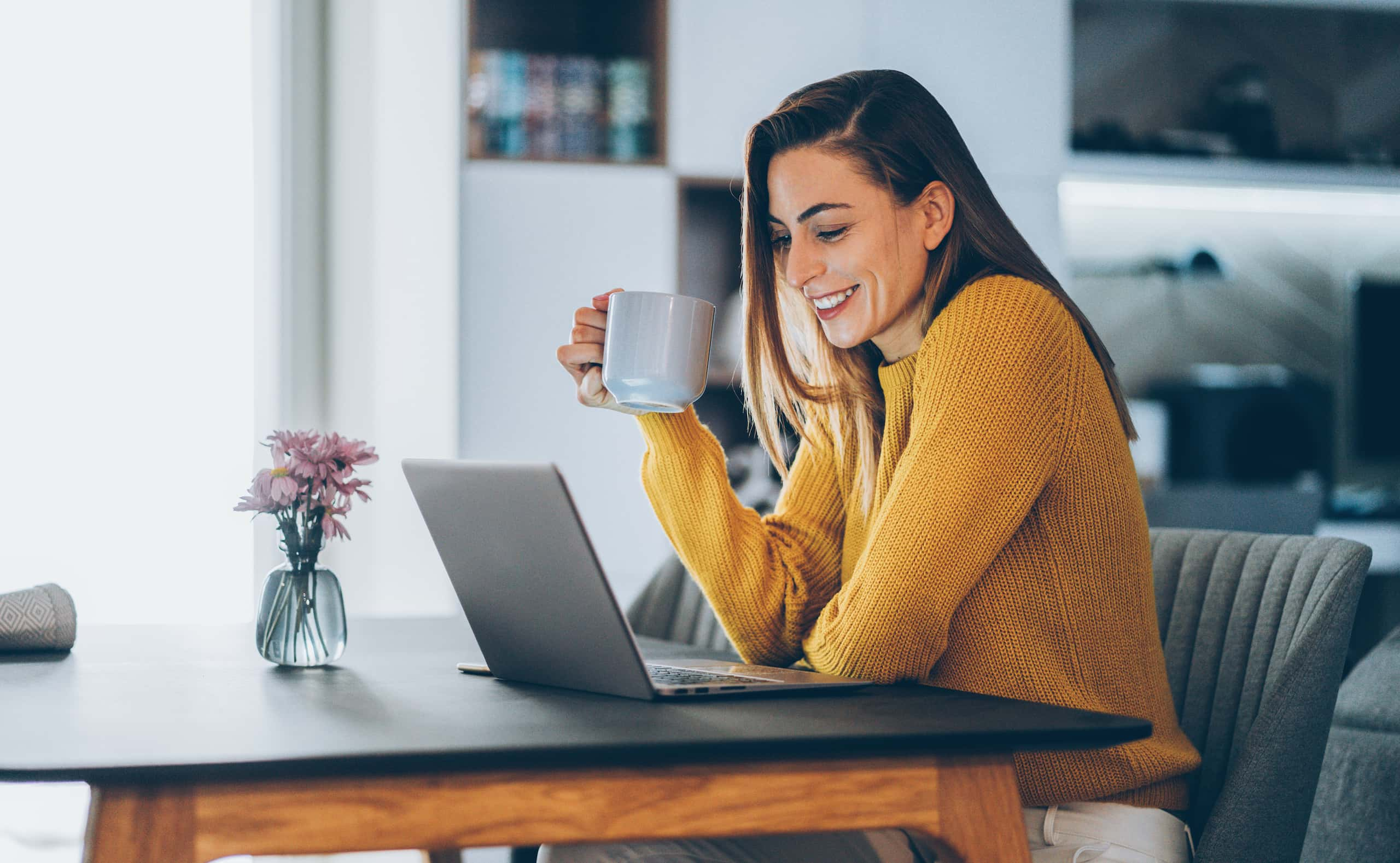 woman at computer with coffee