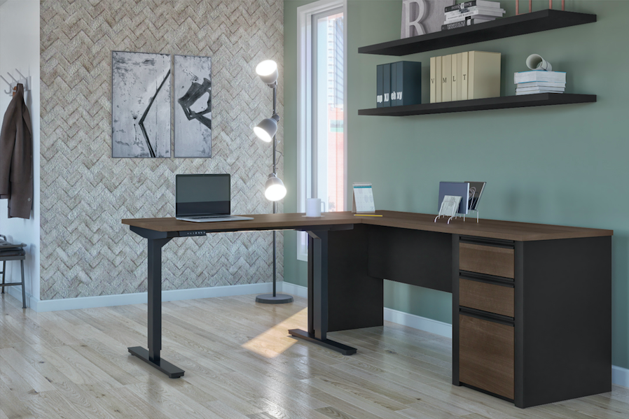 standing desk with storage with shelves and patterned wall and lights