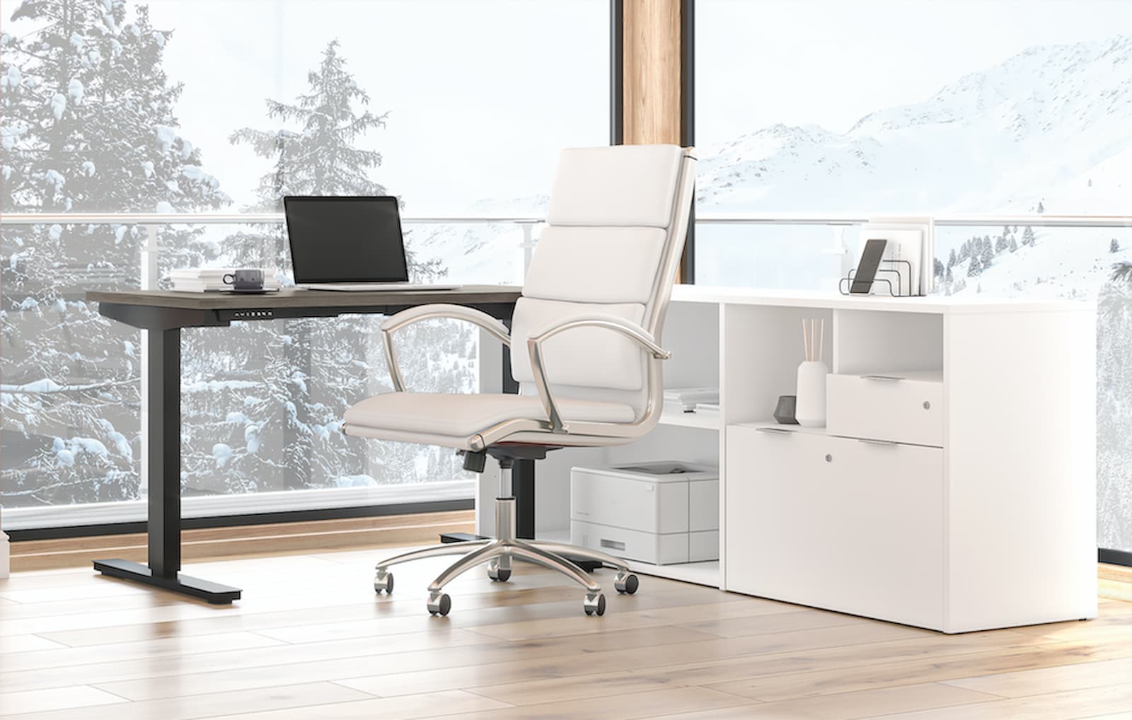 l-shaped standing desk with white credenza and white swivel chair. laptop on the standing desk. snowy mountains and trees outside.