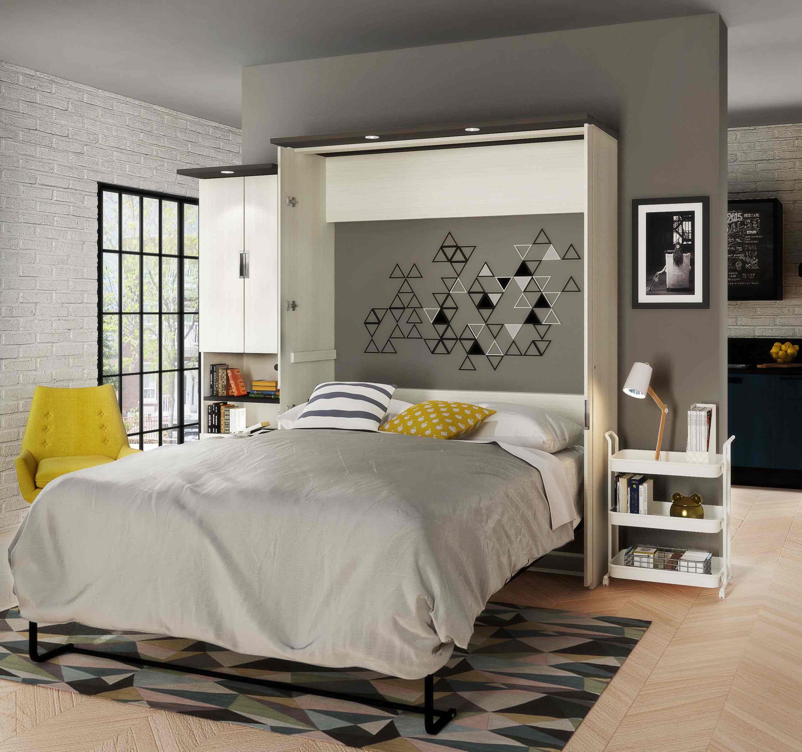 Modern bedroom with a Murphy bed and yellow accents