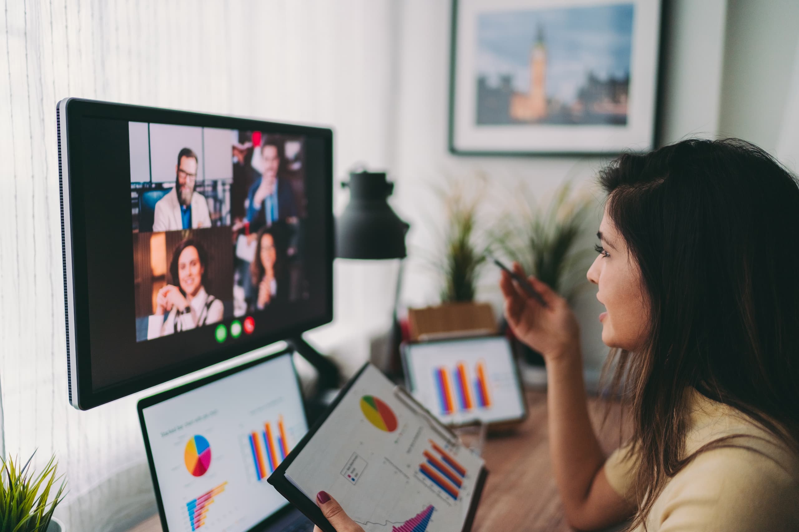 Woman talking to colleagues in an online meeting